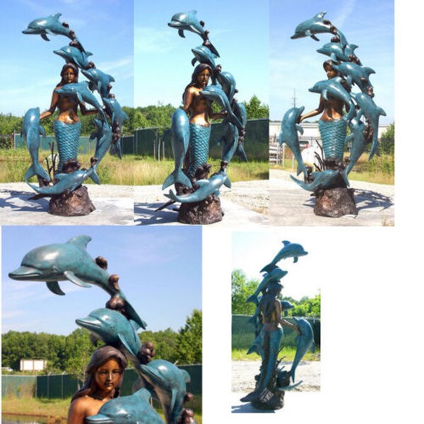 Huge bronze dolphin and mermaid water fountain feature piped